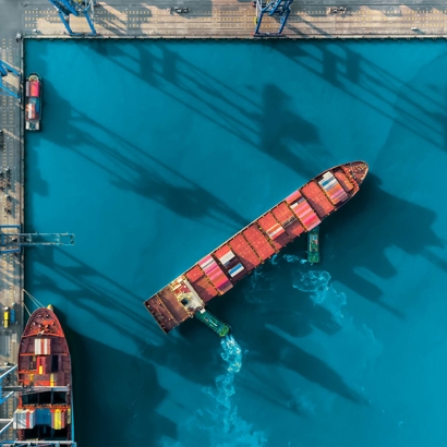 Cargo ship turning in port