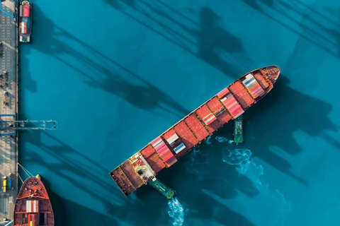 Cargo ship turning in port